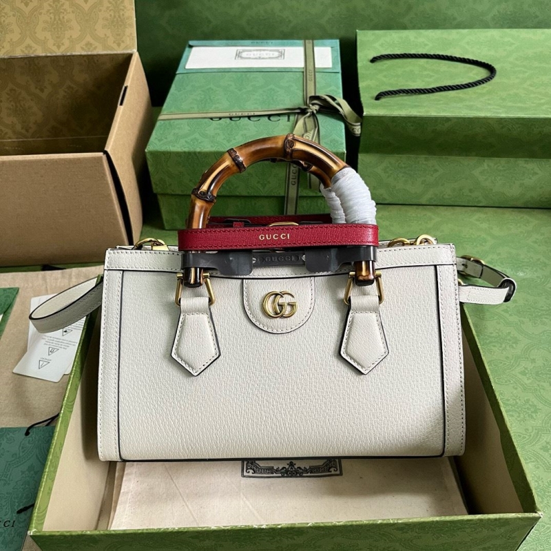 G*u*i top handle bags